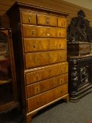 An eighteenth century walnut chest-on-chest with oak ends, the upper section having three short
