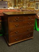 A mahogany chest of three long and two short drawers, brass swan neck handles, on bun feet and