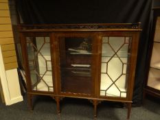 A good mahogany three-door china cabinet with galleried top and having astragal panes of glass to