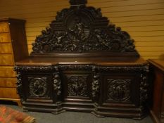 An impressive dark-stained oak Victorian breakfront-sideboard of massive proportions heavily