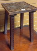 A square topped floral carved Welsh table on four diamond-motif carved supports, 12 x 12ins