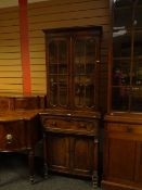 A nineteenth century figured mahogany secretaire bookcase, the upper section having twin doors