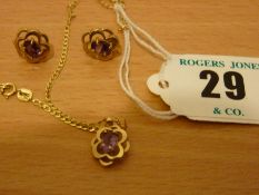 A nine carat gold neck chain with English Rose and purple stone pendant and pair of matching