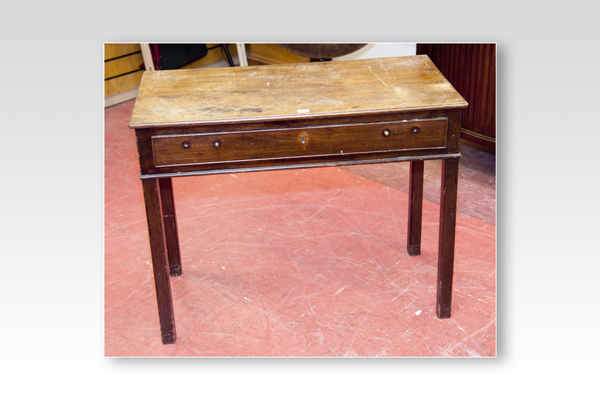 A Georgian mahogany oblong side table with long narrow drawer and square corner supports