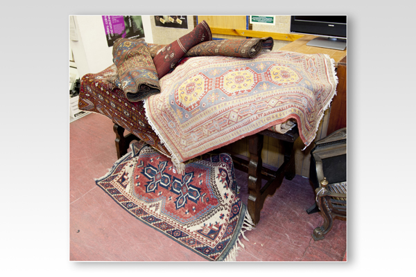 A very large parcel of late 19th and early 20th Century Oriental rugs and runners