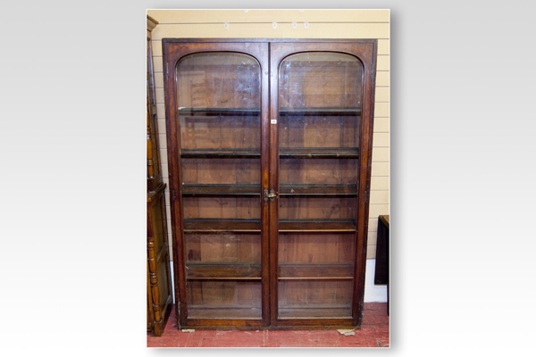 An early Victorian mahogany two door glazed top of a bookcase, now a floor standing bookcase