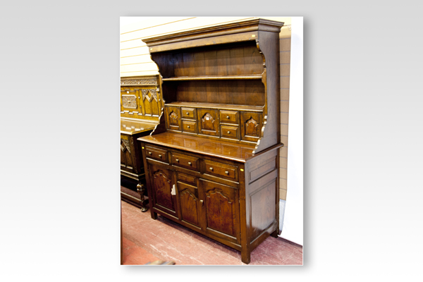 An excellent reproduction of an 18th Century oak Welsh dresser, the two shelf rack having a centre