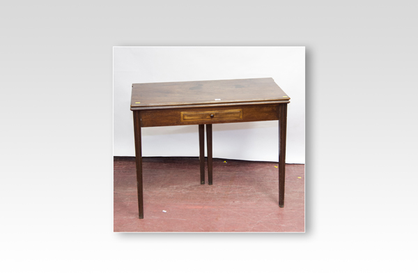 A Georgian mahogany oblong topped fold-over tea table with small centre drawer and tapered square
