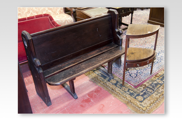 A stained pitch pine settle pew; and a mahogany two tier corner washstand with small drawer