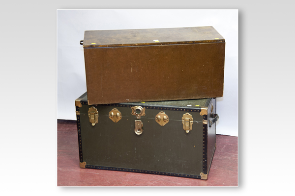 An oblong metal mounted luggage trunk; and a wooden blanket box