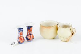 A pair of early 20th Century miniature Imari vases (rim chip to one), 2.75 ins (7 cms) high; and a