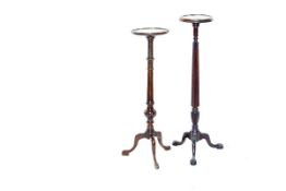 Two mahogany planter stands, one with reeded column to tripod and pad supports, the other with a