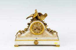 A white marble encased oblong based mantel clock, the drum dial having Roman numerals and with two