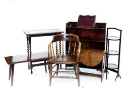 A small polished oblong barleytwist occasional table; a desk type chair; a polished bookcase; and
