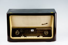 A wooden encased `Telefunken Operrette` radio with bakelite buttons
