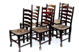 A set of six reproduction elm ladderback Lancashire dining chairs with rush seats, turned stretchers