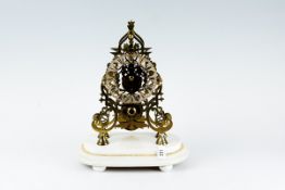 A 19th Century brass skeleton clock with single fusee movement on an oval white marble base with