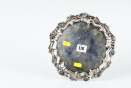 A circular silver letter tray with scrolled and leaf border, 10 ozs, Sheffield 1917