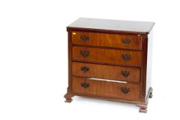A small late 19th/early 20th Century mahogany chest of four graduated drawers with brass drop