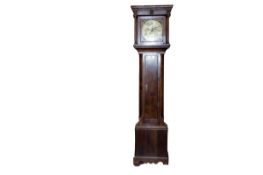 An 18th Century oak long case clock having a caddy top with turned pillars and having a long