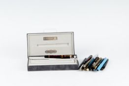 A cased red mottled Parker Duofold fountain pen and a large parcel (approximately twenty) of mixed