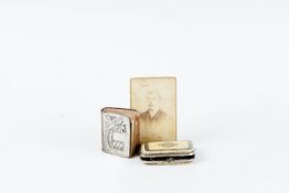 A tiny silver birthday book dating from 1890 with a silver front cover - `Birthdays`; and a coin