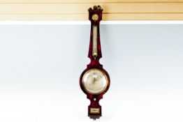 A feathered mahogany banjo barometer with silvered dial by W Fase, Walworth