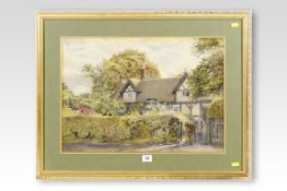 W ROBINSON watercolour; thatched cottage with two figures at a gate, signed and dated 1892, 14.5 x