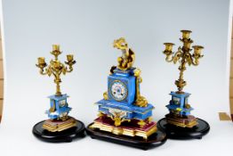 A French blue and floral porcelain and ormolu eight day mantel clock, the eight day striking