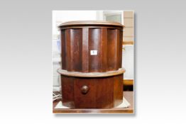 A Victorian cylindrical commode stool, the body with concave panels and having a tapestry seat and