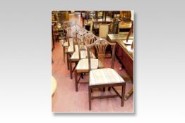 Four Hepplewhite style mahogany dining chairs, all with pierced and shaped centre splats and
