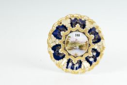A fine Coalport china cabinet plate having a richly decorated cobalt blue and gilt wide border and