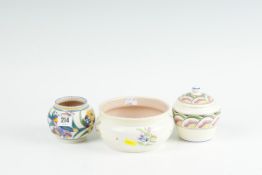 A small Poole Pottery floral decorated bowl; a Poole England cream ground bowl with floral