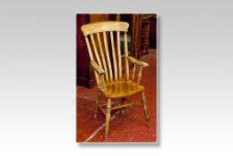 A Windsor light wood splatback elbow chair