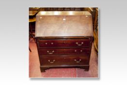A 19th Century mahogany bureau, the slope front having an interior centre cupboard with drawers