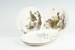 A pair of Johnson Bros `pheasant and grouse` circular plates; and a pair of oval Midwinter