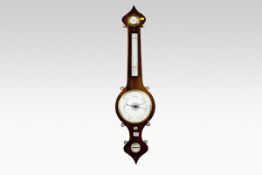 A rosewood encased onion head banjo barometer, the frame having mother-of-pearl inlaid drum scrolls,
