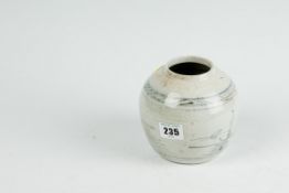 A primitive Oriental pottery ginger jar with grey decoration (hairline crack to the base)