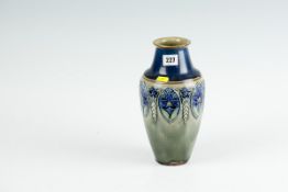 A Royal Doulton green ground baluster vase with deep blue neck and a central stylised floral