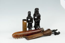 Two carved standing native figurines; and three wooden part woven and leather containers for