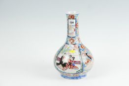 A late 18th/early 19th Century famille verte/famille rouge narrow necked bottle vase having four