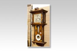 A polished encased wall clock barometer having a square silvered dial with striking movement over