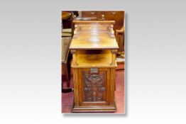 A substantial Edwardian burr walnut coal cabinet having a rail back with shaped side brackets to a