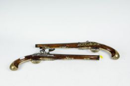 A pair of Continental, possibly Spanish, flintlock duelling pistols having chased steel barrels