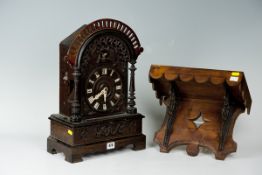 A pine encased Black Forest style dome topped cuckoo clock with carved decoration and side shaped