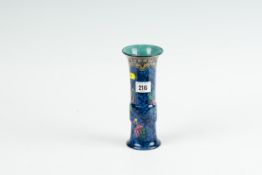 A blue ground Losol Ware floral decorated chimney vase, 8 ins (20 cms) high
