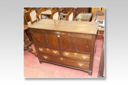 An oak mixed period dower chest, the front having four top panels with two short and one long drawer