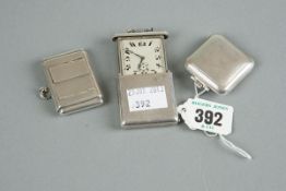 Three silver encased travelling watches