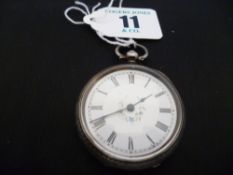 A silver encased lady`s fob watch with white enamel dial and Roman numerals
