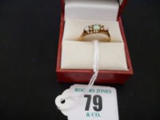 An eighteen carat gold three stone oblong ring, set round cut opals